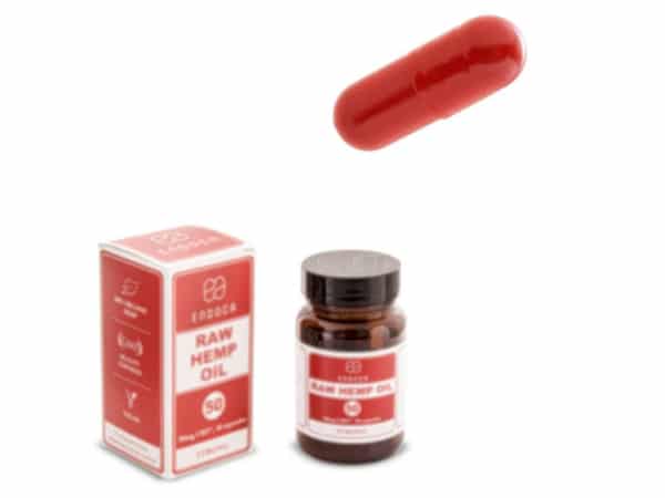 a red Endoca CBD capsule and a box of Endoca CBD capsules (30 pcs).