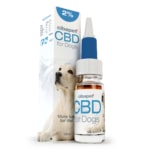 A box of CBD pastilles for dogs (3,2mg) next to a bottle.
