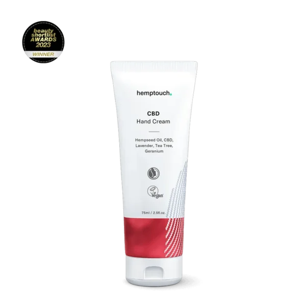 A 75ml tube of Hemptouch CBD Hand Cream, featuring hempseed oil, lavender, tea tree, and geranium, is set against a black background with an award logo above.